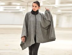 "Wool Cape Poncho ◈ Stylish and chic fashion is our shared dream! You can be sure that this piece is made with a lot of love and craftsmanship. ◈ S I Z I N G ◈ Poncho's width: 1.40 cm/ 0.55\" Due to the fabric specifications, sleeves of the plus size models will be shorter. Convo me for more questions! This item is available from XS to 4XL. Please, have a look at my Size Chart below before placing your order. ◈ D E L I V E R Y ◈ This item will be shipped in up to 5 days after your order was plac Gray Oversized Cape Outerwear, Oversized Gray Cape Outerwear, Oversized Gray Cape For Fall, Oversized Cold Weather Cape, Oversized Shawl For Winter, Oversized Shawl Winter Outerwear, Oversized Shawl Outerwear For Winter, Oversized Batwing Sleeve Outerwear For Winter, Oversized Winter Outerwear With Batwing Sleeves