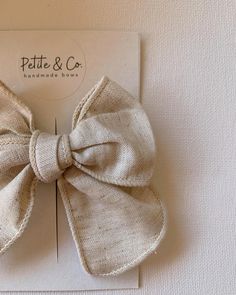 a close up of a bow on a card