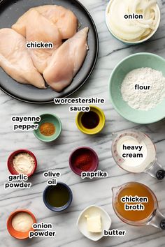 ingredients for chicken broth laid out on a marble counter top, including eggs, flour, butter, and seasonings