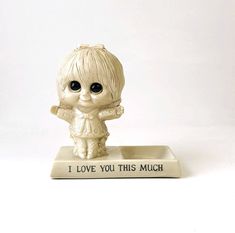 a little figurine that says i love you this much