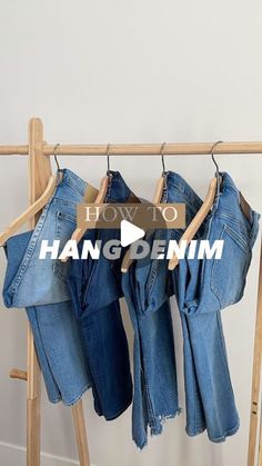 jeans hanging on a clothes rack with the words how to hang denim in front of them