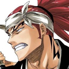 an anime character with red hair wearing a bandana and looking at something in his hand