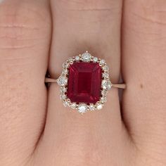 Item Type: Ring Gold Purity: 14k  Gold weight: 3.17 grams Diamond: 20 diamonds totaling 0.42 cts   Stone specs: Type: Ruby  Weight: 2.6 cts Shape: Emerald Cut Size: 9x7.5mm Treatment: Fissure Filled Hardness: 9 Shop Policies: Warranty One year warranty is automatically offered with all purchases of $500+     -- This covers all accent diamonds and loose prongs     -- An extended warranty can be purchased for an additional charge *Please note, any work done on the jewelry by an outside vendor will void this warranty. Contact us first and we can find the best options together to keep your jewelry safe* Domestic shipping: Packages ship via USPS first class mail (3-5 day delivery) Upgrades are available: https://www.etsy.com/listing/938181729/ International Shipping: -- Cost and delivery times Ruby Rings Women, Ruby Jewelry Ring, Antique Ruby Ring, Red Ruby Ring, July Birthstone Ring, Ruby Ring Gold, Ruby And Diamond Ring, Red Ring, Jewelry Safe