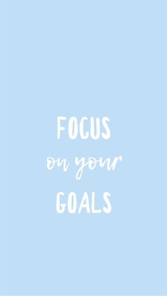 the words focus on your goals written in white against a light blue background with an arrow