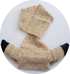 a knitted sweater and booties sitting on top of each other