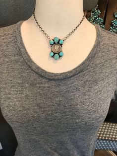 Sterling silver and turquoise. Genuine Mercury dime. Sterling drop accents. Link chain. Adjustable from choker to full 20” length. Pendant measures 1 7/8” long and 1 1/8” wide at the widest point. Stamped sterling and signed by Navajo artist. Nickel-free Western Style Necklaces, Nickel Free Western Style Necklaces, Western Style Nickel Free Necklaces, Adjustable Sterling Silver Turquoise Necklace, Blue Oxidized Finish Jewelry, Sterling Silver Turquoise Necklace With Large Pendant, Silver Coin Pendant Choker, Silver Artisan Choker Jewelry, Artisan Silver Choker Jewelry