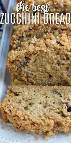 the best zucchini bread is cut in half on a white plate with text overlay