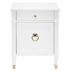 a white nightstand with gold handles on the top and bottom drawer, against a white background