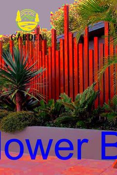 an orange and blue sign that says flower box in front of a red fence with palm trees