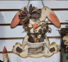 a rabbit decoration hanging from the side of a wall