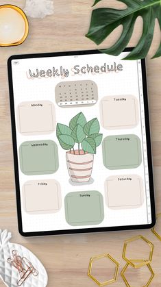 the weekly schedule is displayed on a tablet next to a cup of coffee and other items