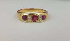 A rare Antique Gold, Ruby and Diamond Victorian set ring Size: O, shank type tapered. Central 3 rubies separated by 4 round cut Diamonds.  Condition Excellent. Net weight : 3.95gm Wedding Ring Gold, Victorian Style Rings, Blue Aquamarine Ring, Ringe Gold, Engagement Wedding Ring, Wedding Pins, Set Ring, Pretty Rings, Diamond Cluster Ring