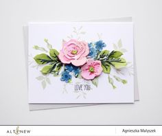 a close up of a card with flowers on it