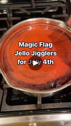 someone is holding a saucepan over an oven with the words magic flag jello jigglers for july 4th