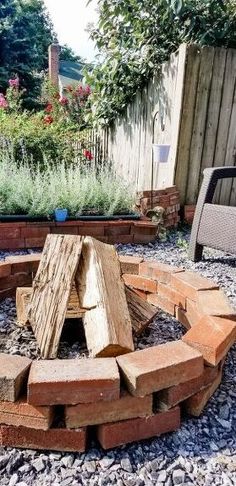 an outdoor fire pit made out of bricks