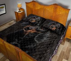 a bed with a black and brown dog on it