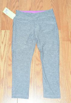 This pair of women's capris are new with tags! ***A stock photo from our inventory has been used to help save time. You will receive the item described in the size listed below!*** MARIKA TEK  Made by Marika Tek, this pair of capris is a great find! These capris are "heather gray" colored! They are fitted with an athletic fit! "Marika Sport is a wear-anywhere sports-influenced clothing line designed to be your next uniform-from the gym to the street.  Each garment is crafted with the latest tech Casual Workout Capri Leggings, Casual Capri Length Workout Leggings, Casual Moisture-wicking Capri-length Bottoms, Casual Moisture-wicking Capri Length Pants, Casual Moisture-wicking Capri Bottoms, Casual Moisture-wicking Capri Pants, Casual Stretch Moisture-wicking Capris, Casual Moisture-wicking Capris For Yoga, Yoga Capris With Pockets