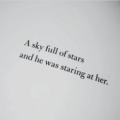 the words are written in black ink on a white sheet of paper that says, a sky full of stars and he was staring at her