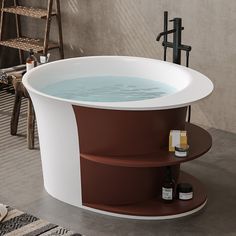 a large bath tub sitting on top of a floor next to a chair and table