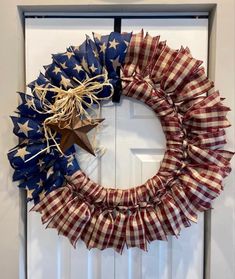 a patriotic wreath hanging on the front door