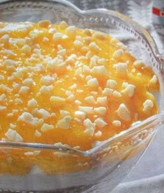 a glass dish filled with food on top of a table