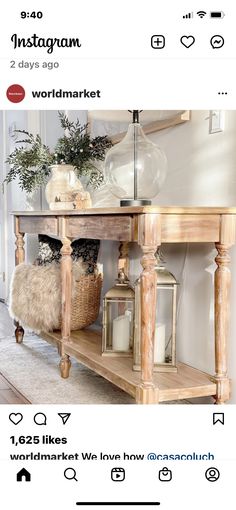 a wooden table with two candles on it