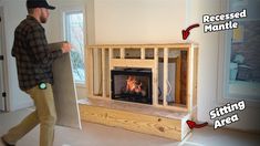 a man is carrying a fireplace in the living room