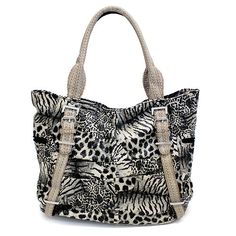 Show off your wild side with this exotic animal print tote bag consisting multi pattern of zebra, leopard, and giraffe. The roomy interior features separate compartments with additional pockets inside for easy organizing. Handles are comfortable for shoulder, arm or hand carry. Color: Black (Multi Silvers Tone Handles) Faux leather exterior with multi animal prints (zebra, leopard & giraffe) Interior black fabric lining Silver tone hardware accented Detailed Handles Separate interior compartment Casual Leopard Print Travel Bag, Leather Bags With Animal Design For Everyday Use, Black Animal Design Bag For Everyday Use, Leopard Print Shoulder Bag With Animal Design, Black Bag With Animal Design For Everyday Use, Black Bags With Animal Design For Everyday Use, Black Shoulder Bag With Animal Design For Daily Use, Leopard Print Everyday Use Bag With Animal Design, Leopard Print Bag With Animal Design For Everyday