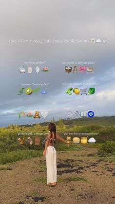 a woman standing on top of a dirt road next to grass and clouds in the sky