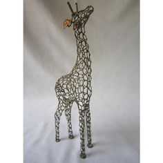 a metal giraffe sculpture is shown on a white background with the top part of it's neck exposed