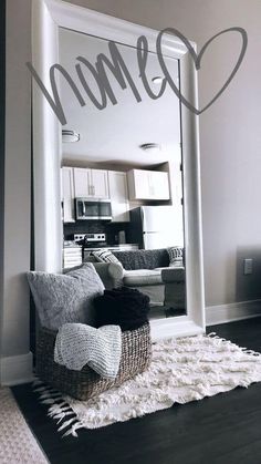 a living room with a couch and chair under a large mirror that says minnesota on it