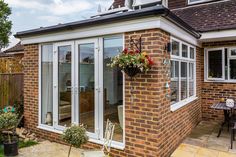 a brick house with an enclosed patio area