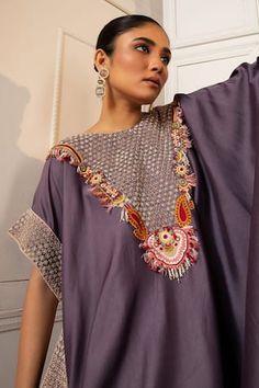 Purple silk asymmetric kaftan with floral pearls, beads, thread work and zardosi embroidered yoke. Paired with coordinating solid straight pant. - Aza Fashions Festival Designer Blouse Piece Hand Embellished, Festival Designer Wear Hand Embellished Blouse Piece, Embellished Designer Kurta For Navratri, Navratri Designer Embellished Kurta, Bohemian Kaftan With Cape Sleeves For Festive Season, Festive Bohemian Kaftan With Cape Sleeves, Traditional Designer Kaftan With Mirror Work, Designer Embellished Kurta With Traditional Drape, Kaftan With Resham Embroidery For Reception Festivals