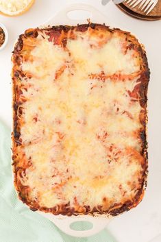 an uncooked lasagna casserole sitting on top of a white plate