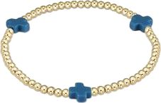 a blue and gold beaded bracelet with cross charms on it's end,