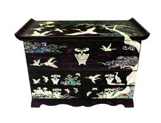 a black and purple chest with birds on it