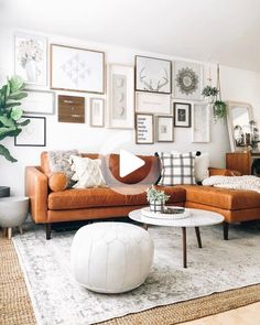 a living room filled with lots of furniture and pictures on the wall above it's coffee table