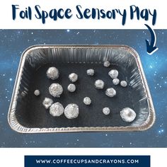 a metal pan filled with snowballs on top of a blue space covered in stars