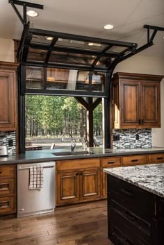 an open kitchen with wooden cabinets and stainless steel appliance on the left side