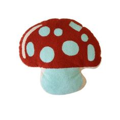 a red mushroom with white polka dots on it