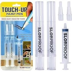 four different types of paint pens in plastic tubes and one is white with black writing on it