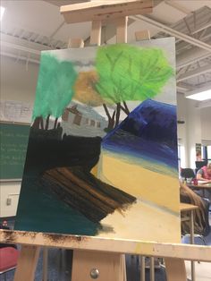 an easel with a painting on top of it