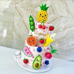 a colorful cake with fruit and vegetables on it