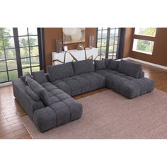 a living room with a large gray sectional couch