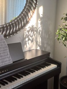 a piano with sheet music sitting on top of it