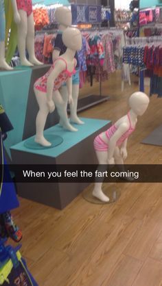 mannequins in swimsuits are on display at the store