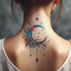 the back of a woman's neck with a crescent and stars tattoo on it