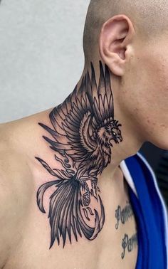 a man with a bird tattoo on his neck