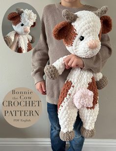 a little boy holding a stuffed animal in his hands and wearing a sweater with the words bonnie the cow on it