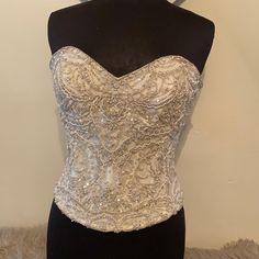 Never Worn Store Sample Good Condition True To Size. Color Is Ivory Elegant White Evening Bodice, Glamorous White Corset With Boned Bodice, Elegant Cream Bodice For Wedding, Elegant Cream Wedding Bodice, Elegant Embellished Wedding Corset, Elegant Beige Wedding Corset, Elegant Cream Wedding Corset, Elegant White Boned Bodice, Elegant White Formal Corset